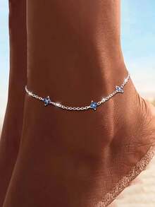Tobillera de plata de ley 925 con trébol de cuatro hojas azul para mujer, con un diseño clásico adecuado para usar en vacaciones en la playa.
