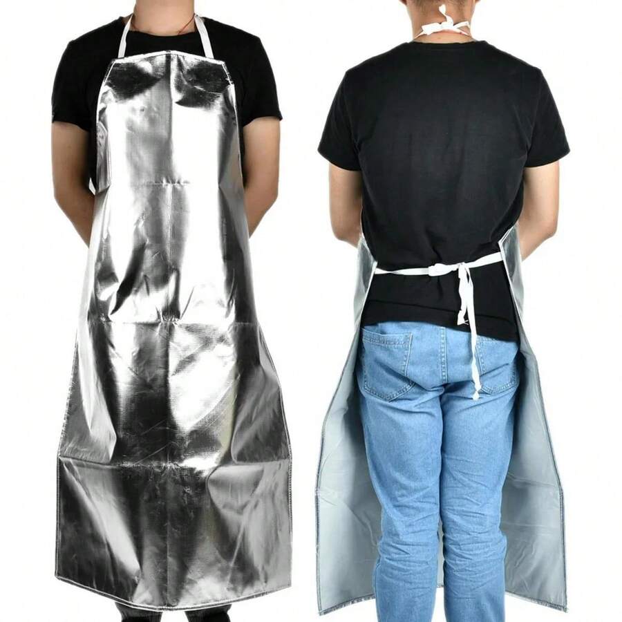 Este delantal de se.guridad aluminizado es fácil de limpiar y poner, resistente al calor, versátil, práctico y previene quemaduras. Es perfecto para cualquier cocina. El cinturón facilita su colocación y su talla es ideal para la mayoría de las personas. - Plateado - Ver 1