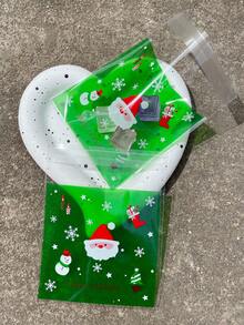 100 pièces Sacs d'emballage cadeaux verts OPP auto-scellants de 10 x 13 cm, avec motifs imprimés de Père Noël mignon et flocons de neige. Convient pour les faveurs et décorations de fête de Noël.