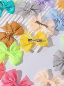 5/20/40个宠物马卡龙蝴蝶结发夹 - 可爱宠物的甜蜜必备单品。柔软有弹性的发夹设计，不会损伤毛发。多种马卡龙色可选。甜美的蝴蝶结造型，非常适合拍照和打卡。非常适合猫咪/小狗日常佩戴或派对造型。