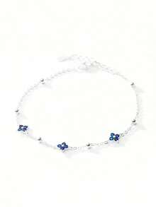Tobillera de plata de ley 925 con trébol de cuatro hojas azul para mujer, con un diseño clásico adecuado para usar en vacaciones en la playa.