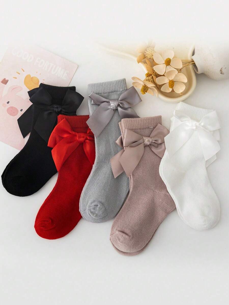 一套5双带蝴蝶结装饰的女婴袜子。这些纯色中筒袜适合日常生活。 - 彩色 - 查看 1