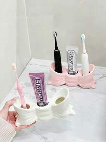 حامل فرشاة أسنان سيراميكي أبيض وزهري، رف تخزين قائم بذاته ب- 3 فتحات لأسطح الحمام، منظم متعدد الوظائف لفرشاة الأسنان ومعجون الأسنان، ديكور منزلي أنيق ومتين، مستلزمات حمام عصرية - متعدد الألوان - مشاهدة 9