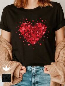Camiseta casual negra para mujer, 100% algodón, con estampado gráfico de corazón grande, camiseta casual y cómoda de manga corta con cuello redondo, ropa de primavera y verano, adecuada para cualquier ocasión, color sólido, casual, uso diario. - Negro - Ver 1