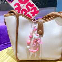 Sanrio 水果串珠手链吊饰 - Hello Kitty 版。官方授权配饰，打造活力造型或甜蜜送礼时刻。