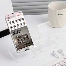 1个优质亚克力桌面手机支架，方便双手清晰观看和安全展示，透明支架配有加厚底座和稳固支架，通用智能手机底座，适用于台面工作台，是厨房、办公室、卧室、梳妆台和收银台的理想之选，提升美感，打造简洁现代的外观，轻巧耐用，方便收纳配件，满足快速取用和多功能用途，适用于大多数手机和小型平板电脑，提升您在时尚和家居布置页面上的产品展示效果和客户体验。 - 彩色 - 查看 2