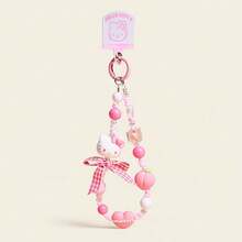 Sanrio 水果串珠手链吊饰 - Hello Kitty 版。官方授权配饰，打造活力造型或甜蜜送礼时刻。