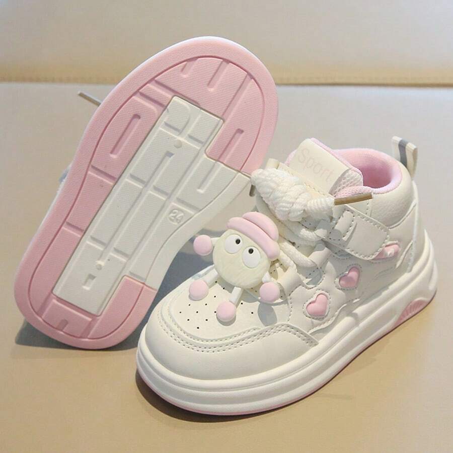 Zapatos deportivos para niños,Estas zapatillas blancas de caña baja para niños cuentan con unos simpáticos y originales muñecos extraíbles en los cordones y suelas blandas para mayor comodidad.