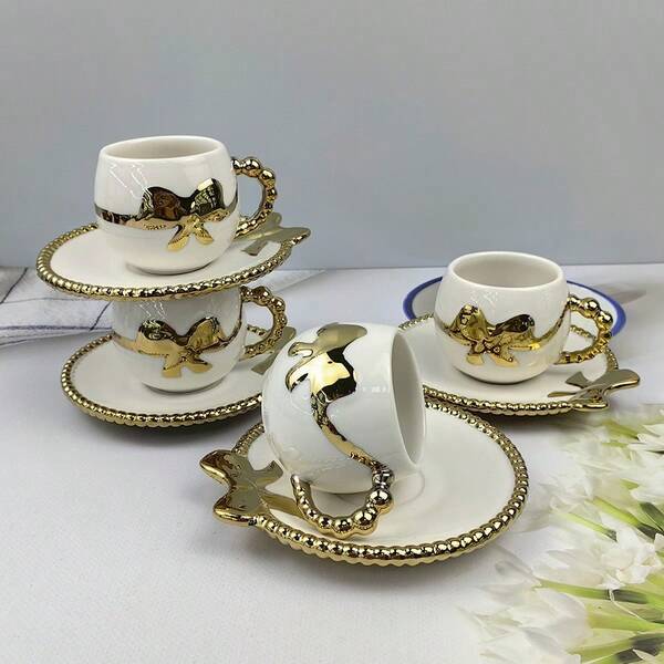 2pcs Ceramic Electroplated Coffee Cup & Saucer Set, Gold/White/Black Ceramic Coffee Cup & Saucer, 1 Cup 1 Saucer With Bow Decor, Electroplated Saucer, Couples Gift, Household Party, Coffee/Tea Cup, Capacity 100ml