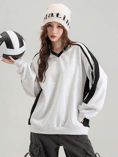 Sudadera holgada con cuello en V y diseño de patchwork a rayas, diseñada para el otoño