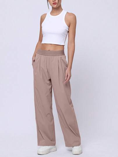 女式轻盈高弹慢跑裤 - 带拉链口袋的休闲速干运动裤。宽松、高弹、透气、速干的运动裤，适合跑步、登山、健身等运动。休闲风格，采用优质柔软面料，舒适透气，富有弹性，适合各种运动场景。