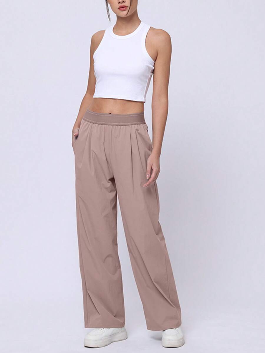 女式轻盈高弹慢跑裤 - 带拉链口袋的休闲速干运动裤。宽松、高弹、透气、速干的运动裤，适合跑步、登山、健身等运动。休闲风格，采用优质柔软面料，舒适透气，富有弹性，适合各种运动场景。 - 粉色 - 查看 1