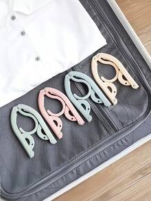 Umerașe de călătorie Macaron Color, multifuncționale, retractabile, portabile, pliabile, umerașe de călătorie pliabile, esențiale de călătorie, umerașe portabile pliabile pentru uscare a hainelor, umerașe pliabile ușoare pentru dormitoare, școli și turism, materiale plastice de uz casnic, accesorii de călătorie esențiale pentru nave de croazieră, suport de uscare pliabil pentru haine de bebeluși pentru casă și călătorii