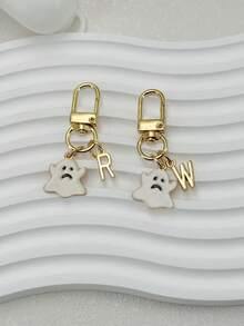 سلسلة مفاتيح بحروف شبح بيضاء