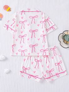 2 件套白色底粉色蝴蝶结印花可爱风格睡衣套装，可穿戴可爱时尚节日派对儿童睡衣，短袖开衫领上衣和松紧腰短裤，休闲四季儿童睡衣和家居服