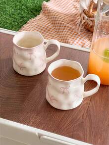 1/2件创意可爱陶瓷杯，手绘蝴蝶结图案，不对称杯身，办公休闲瓷茶杯，家用早餐杯，下午茶饮具，实用陶瓷器皿 - 彩色 - 查看 5