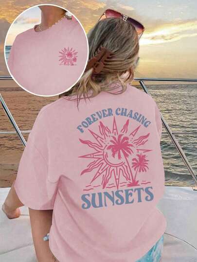 Camiseta de mujer de manga corta con cuello redondo, estampado de árboles de coco, sol y eslogan "PERSIGUIENDO PUESTAS DE SOL PARA SIEMPRE", estilo casual, holgado y versátil, adecuada para uso diario y vacaciones de verano