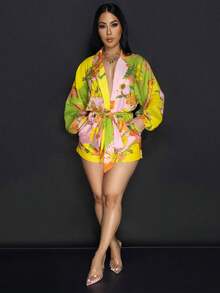 Mono de mujer con estampado floral, mangas farol, bolsillo y cuello de solapa