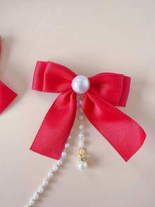 1 szt. dziewczęca, modna, śliczna spinka do włosów z kokardką i frędzlami. Nieznaczna różnica w kolorze może wynikać z partii materiału. Szczegóły na opakowaniu i w opisie produktu. Ilość perełek jest losowa. - Czerwony - Zobacz 2