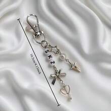 1 个 SKZ 钥匙扣 - K-Pop 风格串珠链，配有心形星星吊饰和 SKZ 字母，采用金色铝合金制成，适用于音乐会纪念品、珠宝礼品、背包装饰 - 完美的情人节礼物 - 彩色 - 查看 10