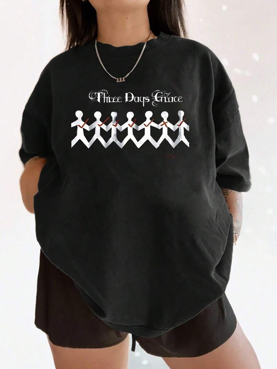 Moderna camiseta gráfica para mujer con un artístico estampado de cadena de papel, una elegante camiseta de manga corta con cuello redondo que es informal y cómoda, y que añade un toque único a tu guardarropa. - Negro - Ver 1