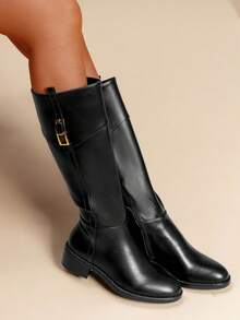 calcena Women's Classic Equestrian Knee-High Boots With A Decorative Top Cuff Strap And Gold-Tone Buckle, Elegant Riding Style With A Low Block Heel And Round Toe For All-Day Comfort - Black - View 1