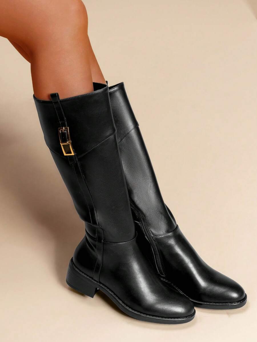 calcena Women's Classic Equestrian Knee-High Boots With A Decorative Top Cuff Strap And Gold-Tone Buckle, Elegant Riding Style With A Low Block Heel And Round Toe For All-Day Comfort - Black - View 1