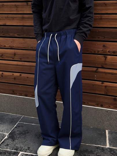 Pantalon décontracté ample à jambes droites pour hommes avec rayures contrastées en patchwork, convient pour le printemps/automne, le port quotidien, les sorties, les activités de plein air, la mode de rue