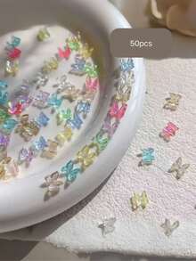50/100 pezzi Mini decorazioni per unghie a forma di farfalla aurora, gioielli per unghie piatti iridescenti a fiocco, accessori per unghie, forniture per unghie, stile Y2K, parti per unghie Y2K, parti per decorazioni fai-da-te, charm per unghie, charm, articoli per unghie