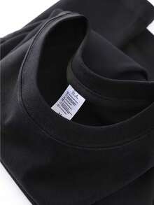 100% Pure Short-Sleeve T-Shirt With A Relaxed Fit, Perfect For Summer, Featuring A Round Neck And A Loose, Stylish Design That Is Versatile For Women. - Black - View 2