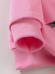 Conjunto de 2 piezas de sudadera rosa holgada con puños y bajo acanalados, cuello redondo, manga larga y estampado de lazo de encaje, emparejada con pantalones negros acampanados de cintura elástica, para niñas en otoño/invierno con estilo vintage y casual