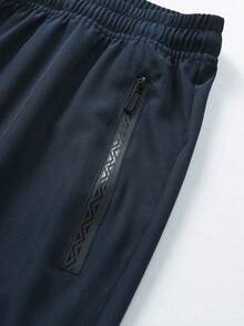 男士加大码宽松休闲运动裤，拉链口袋，抽绳腰带，修身显瘦，适合日常穿着和运动 - 轻便透气，适合春夏穿着