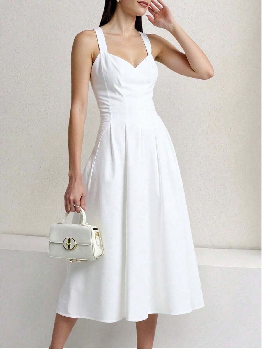 vestido midi combina un diseño refinado con tirantes anchos y escote favorecedor que realza la silueta femenina. Su falda con pliegues aporta movimiento y caída elegante, ideal para ocasiones especiales como fiestas, cenas formales, bodas o cócteles. Fabricado con detalles de calidad, ofrece comodidad y estilo a la vez. Una prenda versátil que se adapta a diferentes eventos, perfecta para destacar con un look moderno, sofisticado y atemporal - Blanco - Ver 1