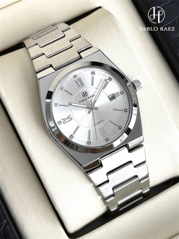 Pablo Raez Montre d'affaires charmante pour hommes PABLO RAEZ d'origine. Montre de luxe de marque vintage. Accessoires d'été et de plage, bijoux. Bracelet en acier inoxydable. Boîtier en acier non terni de couleur argent et noir. Aiguilles luminescentes. Résistante à l'eau jusqu'à 50 m. Affichage simple du calendrier et de la semaine. Cadran avec chiffres romains et graduation. Cadeau de mariage