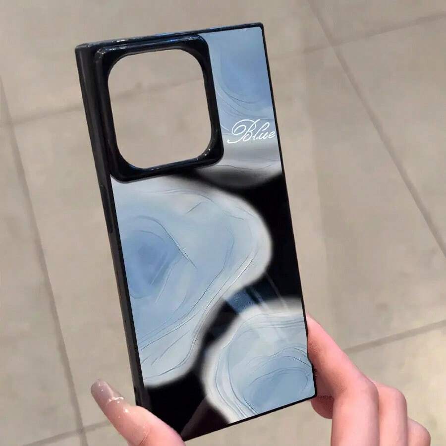Un teléfono con un diseño de bloque de pigmento azul, compatible con los modelos 16 Pro, 16, 15 Pro, 14, 14 Plus, 13, 13 Pro, 12 Pro y 12 Pro. Ofrece una cobertura completa a prueba de golpes, un corte grande, un marco elegante y brillante y mejorado. - Negro - Ver 1