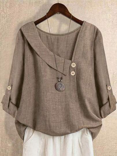 قميص نسائي كبير الحجم بلون أحادي ذو ياقة غير متماثلة وأكمام طويلة قابلة للطي مع ربطة عنق، مناسب لجميع المواسم