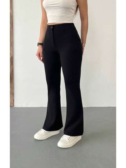 Dambyxor med hög midja i flexibla Lycra-tyg och klockformad nederkant