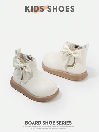 1双蝴蝶结装饰儿童鞋，采用皮革材质，圆头，短靴款式，侧拉链，无明显鞋跟，可爱甜美儿童休闲鞋，适合日常外出和聚会