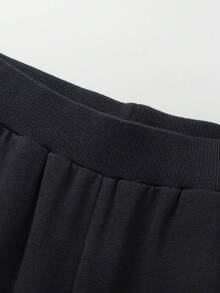 Quần dài cho bé gái tuổi teen Quần jogger cho bé gái mùa thu 2025 mới có gấu quần thun thời trang - màu đen - Xem 3