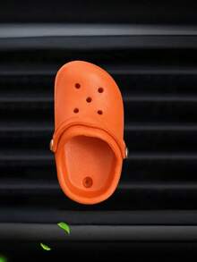 La decoración práctica de la salida de aire del agujero del zapato del coche es divertida.