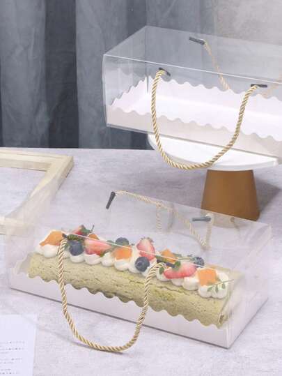 Dikdörtgen Şeffaf PET Kek Rulosu Ambalaj Kutusu, Hem Görünüm Hem de Pratiklik Açısından Mükemmel. Göz Alıcı İsviçre Rulosu ve Fırınlanmış Kekleri Net Bir Şekilde Sergilemek İçin Yüksek Çözünürlüklü Şeffaf Malzemeden Üretilmiştir. Şık Stiliyle Hediyelik veya Kişisel Kullanım İçin Uygundur. Hafif ve Taşıması Kolay, Fırınlanmış Ürünleri Deformasyondan Korumak İçin İyi Sızdırmazlık Özelliğine Sahiptir. Fırın Tutkunları İçin Olmazsa Olmaz Bir Ürün.