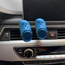 La decoración práctica de la salida de aire del agujero del zapato del coche es divertida.