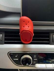 La decoración práctica de la salida de aire del agujero del zapato del coche es divertida.