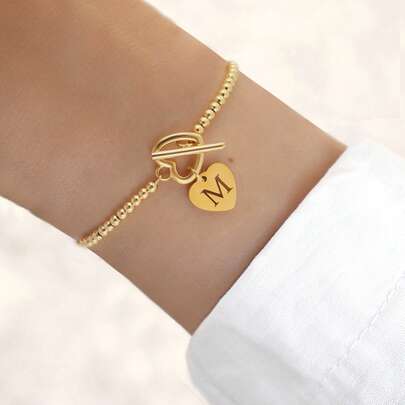 1 stuk nieuwe klassieke gouden roestvrijstalen hartvormige armband met holle initialen en verstelbare kralen voor dames