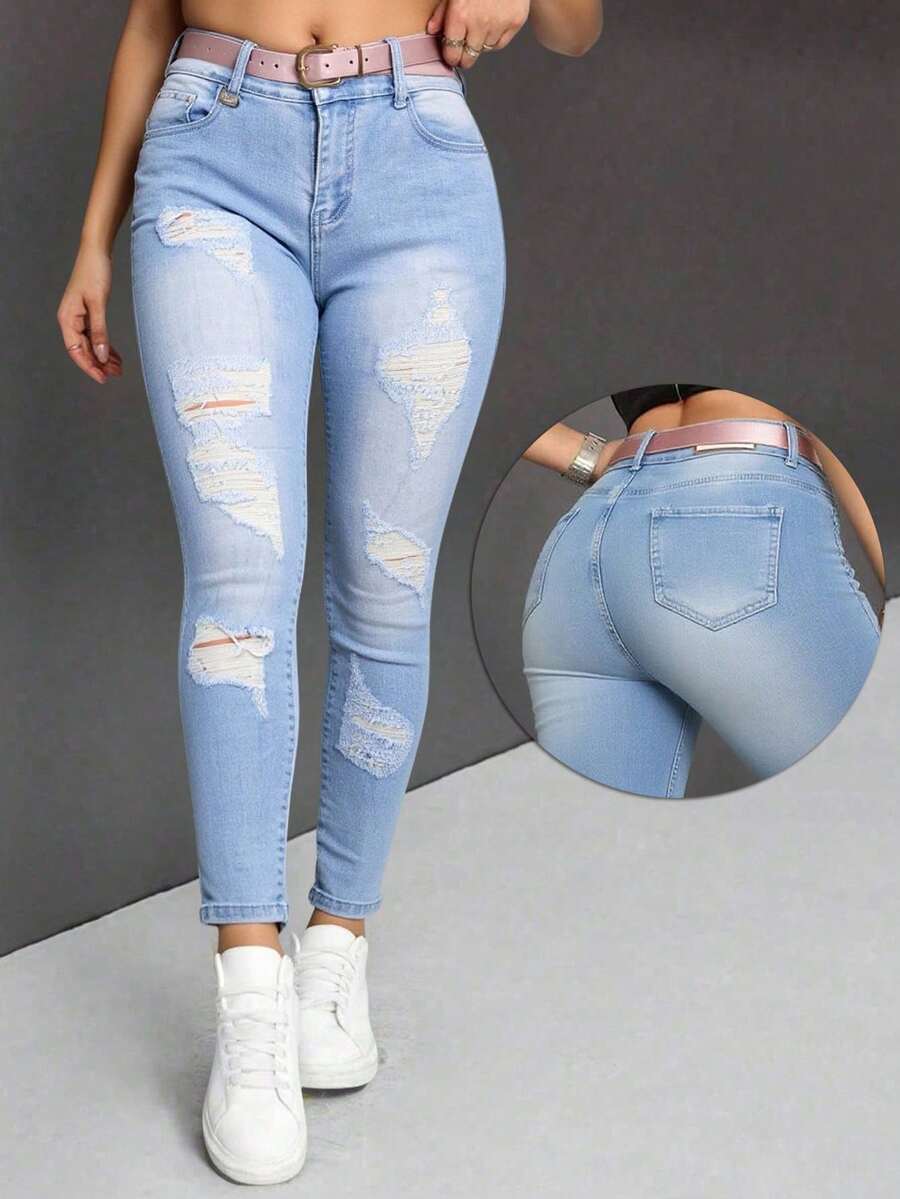 Pantalones vaqueros ajustados de tiro alto en azul claro con roturas y cinturón rosa, modernos y versátiles - Lavado ligero - Ver 1