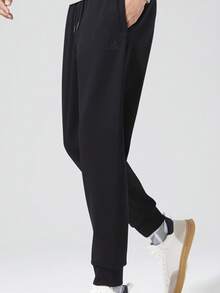 CAMEL CROWN 男士休闲裤秋冬新款纯棉针织运动裤修身袖口百搭运动裤 - 黑色 - 查看 1