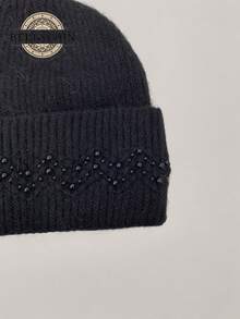Beautiful Plain Knit Hat With 3D Weave And Faux Pearl Details In A Geometric Pattern. Versatile And Perfect For Any Style. Thick And Warm, This Lovely Winter Hat Is Perfect For Outdoor Activities. Handmade, This Stylish Hat Is Perfect For Keeping Warm In Winter And Fall/Winter.