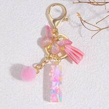 1个个性化粉色字母钥匙扣，配有可爱蝴蝶吊坠 - 树脂材质，爱心亮片字母吊坠钥匙扣 - 时尚配饰，适用于包包、背包和车钥匙 - 是送给女性和女孩的理想圣诞礼物，可作为包包配饰、挂绳、证件夹、汽车配饰、包包挂饰、汽车配件、老师、朋友、姐妹的礼物 - 粉色 - 查看 14