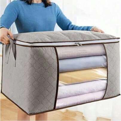 灰色可折叠收纳袋，带提手和透明窗口，适用于收纳衣物、床上用品、毛衣、枕头和衣柜物品，是搬家、上学和日常收纳的理想之选，也是居家整理的必备品。