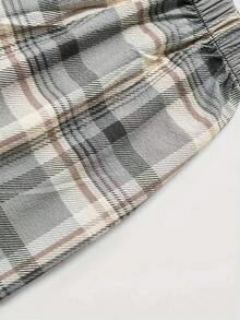 Nowe męskie spodnie w kratę z elastyczną talią i luźnymi spodniami do chodzenia